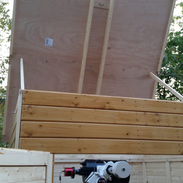 inside observatory view with partially opened roof standing itself  on 2 support legs